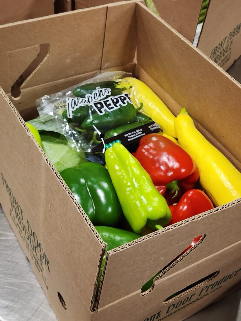 Fresh vegetable box supporting the Bunnell Sr. FFA Chapter at Flagler Palm Coast High School, featuring a variety of local produce for pickup on April 30th.